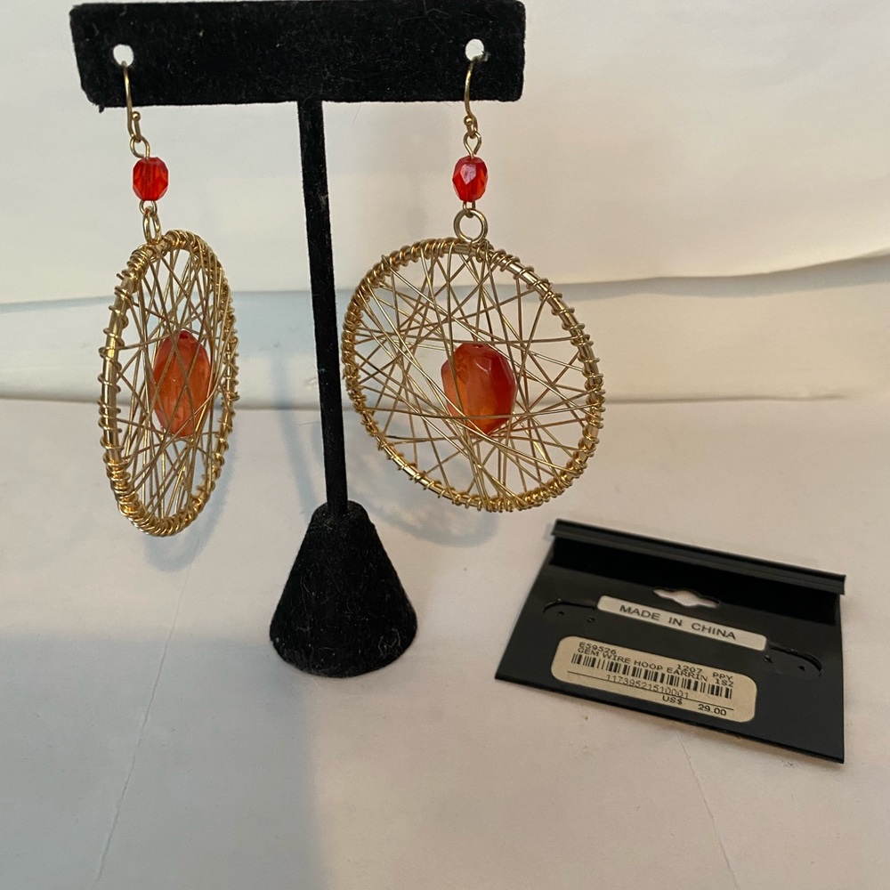 Bebe wire hoop earrings in gold.  Large orange stone inset 2” hoop